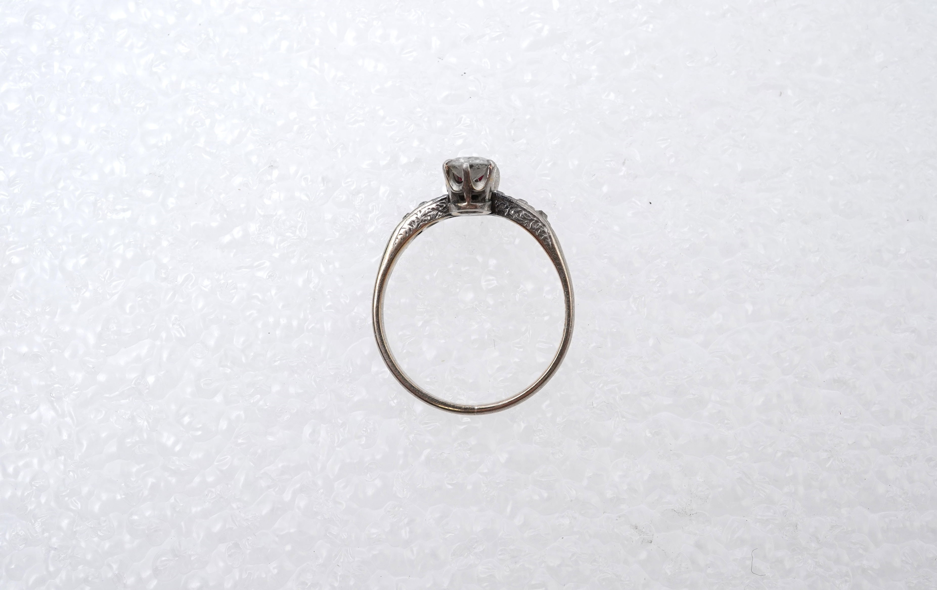 A synthetic ruby and diamond 'toi-et-moi' ring, early 20th century